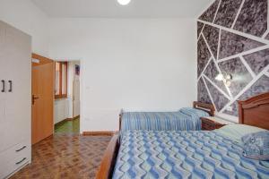 Postel nebo postele na pokoji v ubytování Casa Vacanza Da Licia