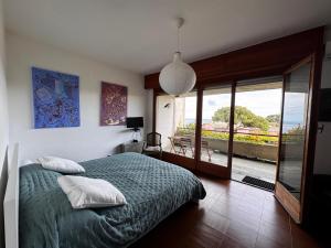 a bedroom with a bed and a view of the ocean at Affitti Brevi Liguria - Villa Gioia in Celle Ligure +39 photos