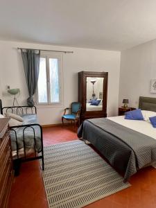 Postel nebo postele na pokoji v ubytování Entre Midi - Maison d'Hôtes - B&B