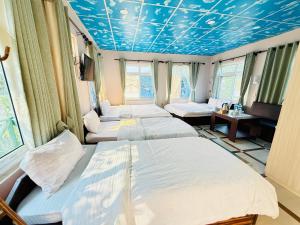Letto o letti in una camera di Hotel Mantra and Adventure