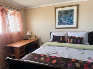 En eller flere senge i et værelse på Grier Place