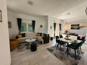 a living room with a couch and a table at Villa Panorama in Bihać