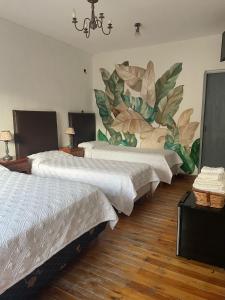 Postel nebo postele na pokoji v ubytování El Colonial