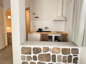 A kitchen or kitchenette at Filoxenia Apartments