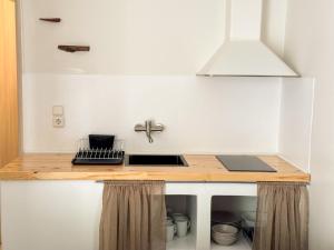 A kitchen or kitchenette at Filoxenia Apartments