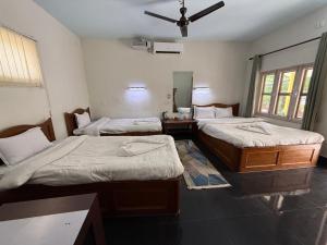 Letto o letti in una camera di Hotel Mantra and Adventure