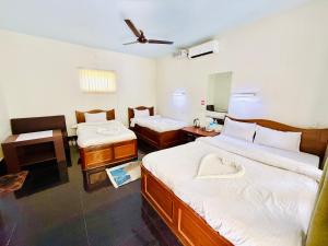 Letto o letti in una camera di Hotel Mantra and Adventure