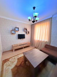 Μια τηλεόραση ή/και κέντρο ψυχαγωγίας στο Apartment555
