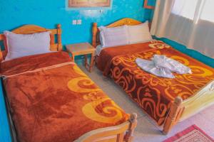 Postel nebo postele na pokoji v ubytování Auberge Toubkal