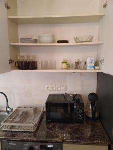 Kuchyň nebo kuchyňský kout v ubytování Apartment Cozy House 1