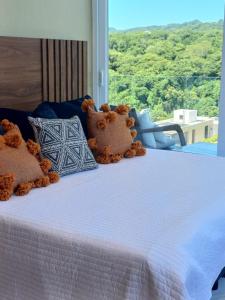 two teddy bears sitting on top of a bed at Cozy Beachfront PH Getaway in Bucerías +15 photos
