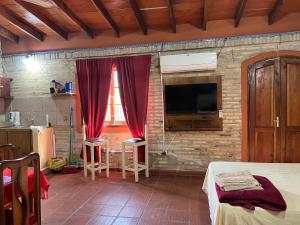 TV a/nebo společenská místnost v ubytování Loft Privado en Casa Tranquila-Ideal para tu Estancia