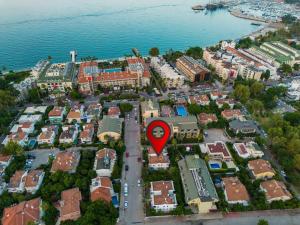 an aerial view of a city with a red marker at AQUA Suite Kemer in Kemer