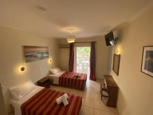 Postel nebo postele na pokoji v ubytování Laganas Holidays Hotel