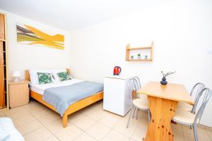Posteľ alebo postele v izbe v ubytovaní NT Holiday Budget