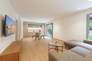 a living room with a couch and a table at Villa Callista Mentone in Menton