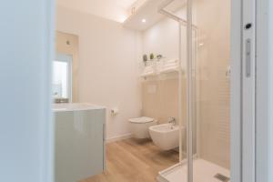 a bathroom with a shower and a toilet and a sink at Valarin Residence & Villa Valarin Elite by Rent All Como in Vercana +148 photos