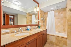 a bathroom with a sink and a shower at Big Island Kolea 14H by Coldwell Banker Island Vacations in Waikoloa +32 photos