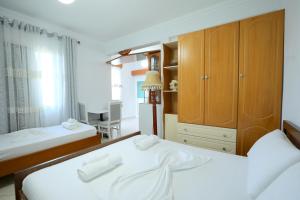 Postel nebo postele na pokoji v ubytování Villa Kevin's