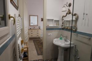 a bathroom with a sink and a mirror at a Casa di Maria in Vieste