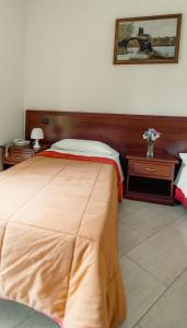 Ένα ή περισσότερα κρεβάτια σε δωμάτιο στο Albergo Settebello