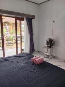 Ένα ή περισσότερα κρεβάτια σε δωμάτιο στο Niraka Home