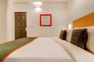 Postel nebo postele na pokoji v ubytování Hotel O Star Key