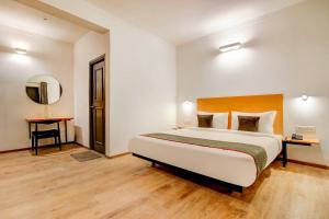 Postel nebo postele na pokoji v ubytování Hotel O Star Key