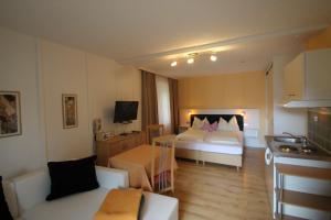 A bed or beds in a room at Seepension Neubacher KG
