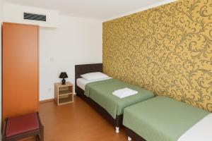 Ένα ή περισσότερα κρεβάτια σε δωμάτιο στο Plava kuća