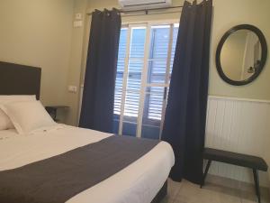 Postel nebo postele na pokoji v ubytování Hostal Mi Campaña