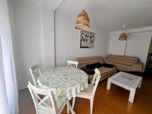 a living room with a table and a couch at La Mata relax in La Mata