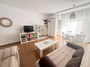 a living room with a couch and a table at La Mata relax in La Mata