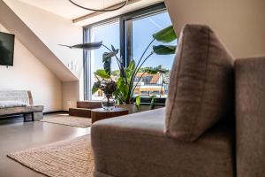 Televízia a/alebo spoločenská miestnosť v ubytovaní Rodinný apartmán s výhledem na zámek