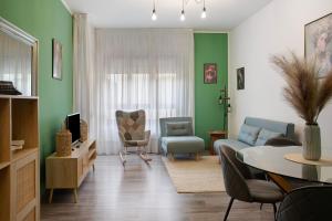 a living room with a couch and a table at Il Rifugio di Sebi in Morbegno