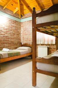 Un pat sau paturi într-o cameră la Complejo 21 de Enero - Luz y Fuerza