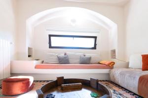 a living room with a couch and a table at Villa Bernardi in Ostuni