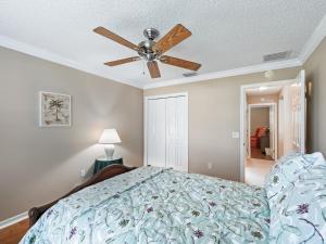 a bedroom with a bed with a ceiling fan at 1095 Z2A VILLAGE OF SUMMERHILL by REMAX Premier in The Villages +15 photos