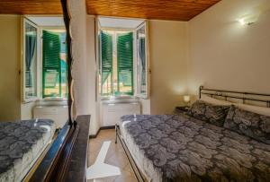 Postel nebo postele na pokoji v ubytování Macaia Room #1 with AC