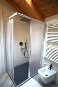 a bathroom with a shower and a sink at Casa Camoscio Piano 2 in Cannobio