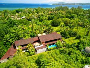 an aerial view of a house in the forest at Gili Buana Hostel & Backpackers Gili Air in Gili Islands