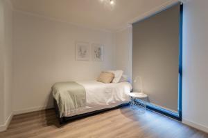 Postel nebo postele na pokoji v ubytování Discover Providencia Luxury and Connectivity