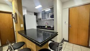Kuchyň nebo kuchyňský kout v ubytování Thermas paradise dois quartos cobertura com area de lazer