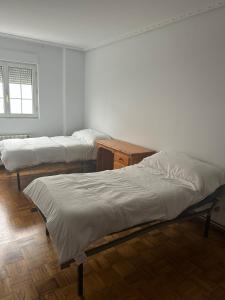 Postel nebo postele na pokoji v ubytování Urb Domañanes + 13 fotografií