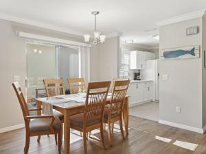 a kitchen and dining room with a table and chairs at 1315 Z2B VILLAGE OF RIO GRANDE by REMAX Premier in The Villages