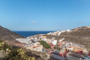 a view of a town on a hill at La Lajita in Tafira Baja