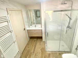 a bathroom with a shower and a sink at Casa la luz in La Portellada +11 photos