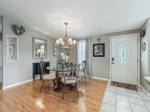 a dining room with a table and chairs at 1640 Z1 VILLAGE OF COUNTRY CLUB HILLS by REMAX Premier in The Villages