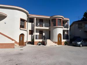 a house with a car parked in front of it at Séjour agréable 4 proche plage in Fréjus
