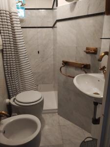 a bathroom with a toilet and a sink at Ca'di Lalu in Fezzano +10 photos